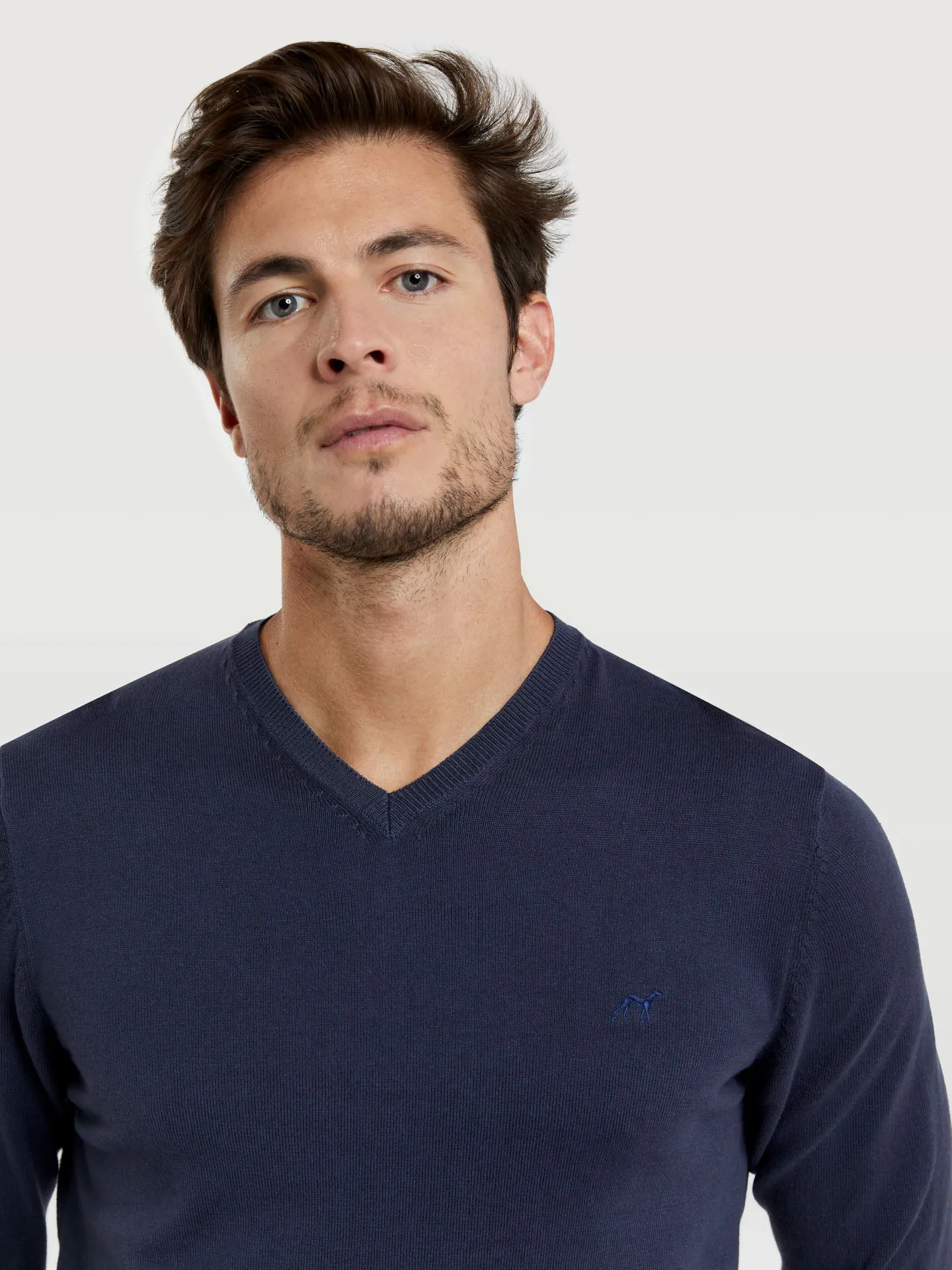 V-neck sweater with denim dye effect